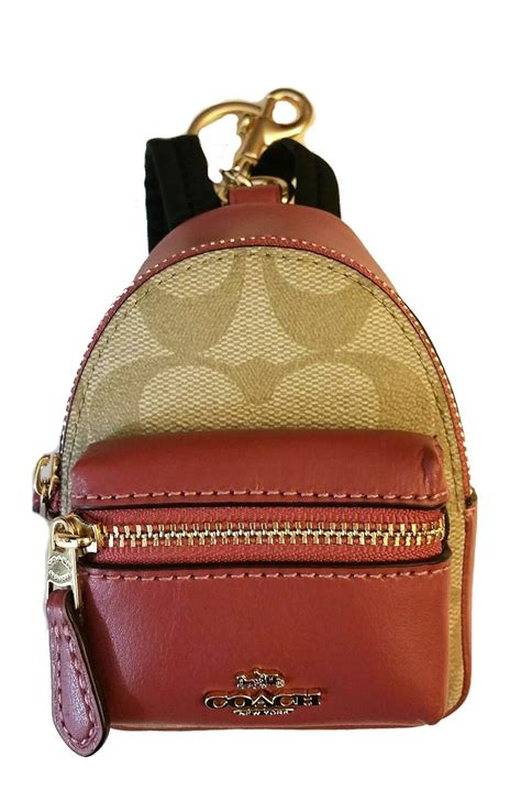 mini coach coin purse backpack.